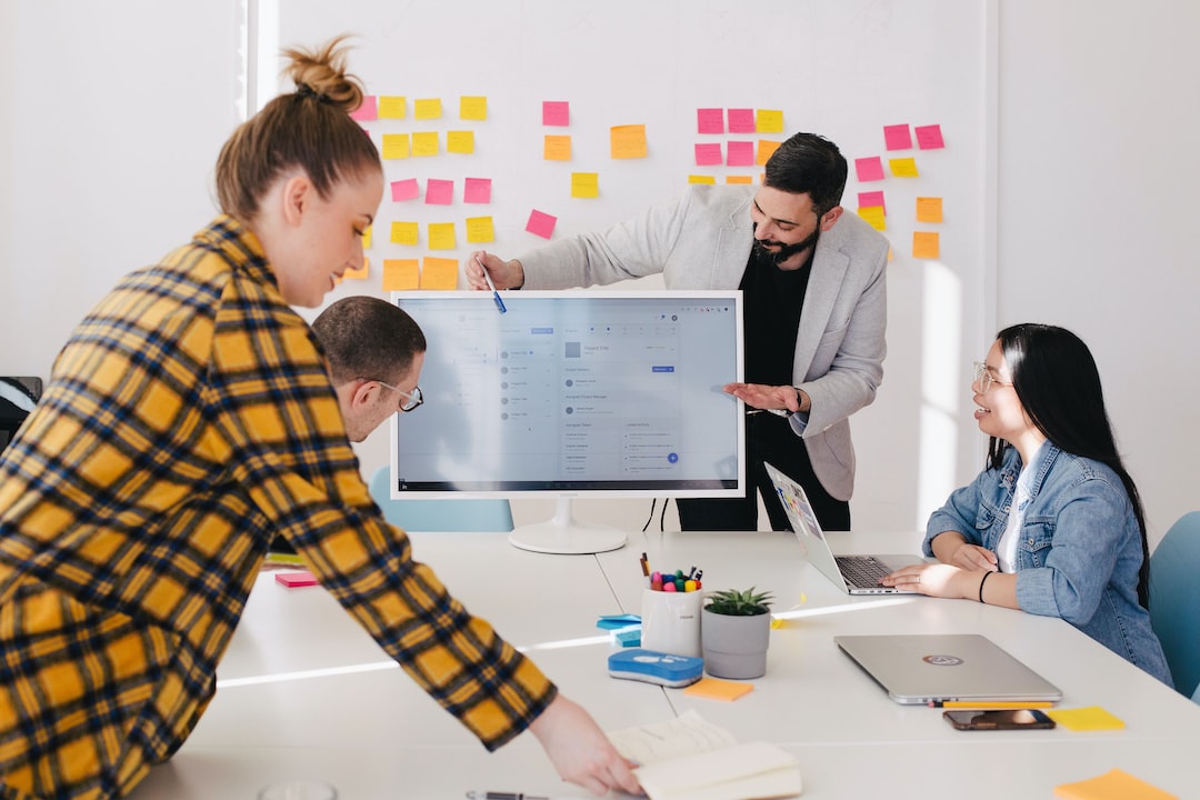 An illustration of a business team in a modern office, analyzing a digital dashboard with graphs, charts, and decision matrices for government RFPs. Professionals are engaged in strategic discussions and reviewing documents, with symbols like scales, checkmarks, and crossmarks representing decision-making. The background includes subtle government-themed visuals, emphasizing critical analysis and planning for government RFPs